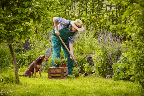 Operative wearing PPE performing pruning tasks